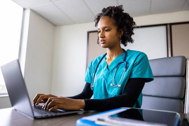 istock Medical student on laptop in classroom 1455610137