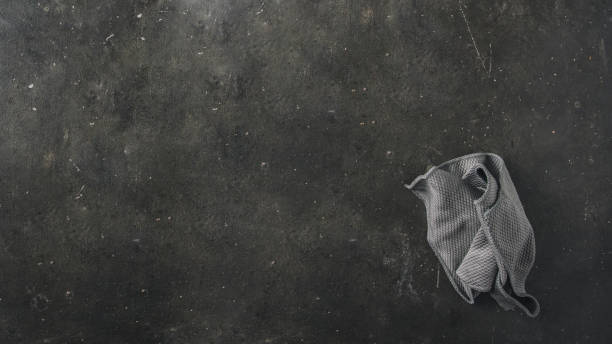 istock Grey cleaning cloth  on dark blackboard.Large image for banner, Study concept 1455612084