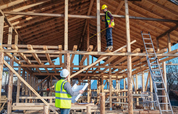 istock Workers building a house made of wood. 1455612528