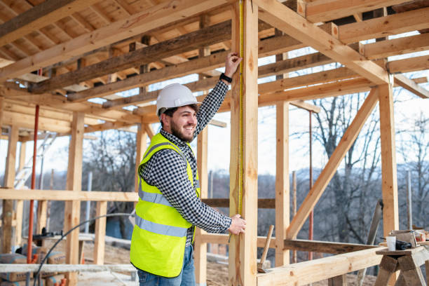 istock Workers building a house made of wood. 1455612544