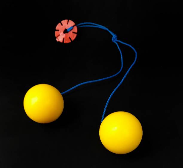 istock children's toy lato lato on a black background 1455614954
