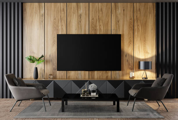 Luxury black and nature wood living room interior with 75" TV front view stock photo