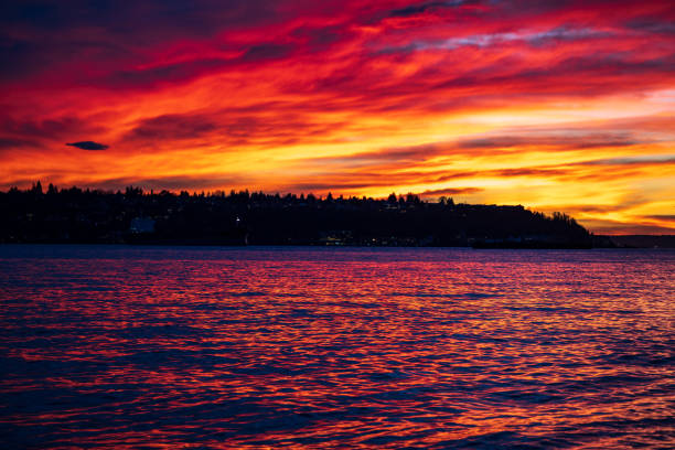 A dramatic sunset Elliott Bay view from Pier 62 in Seattle, WA.