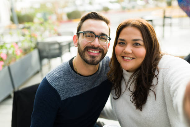istock Attractive beautiful couple taking a selfie 1455624624
