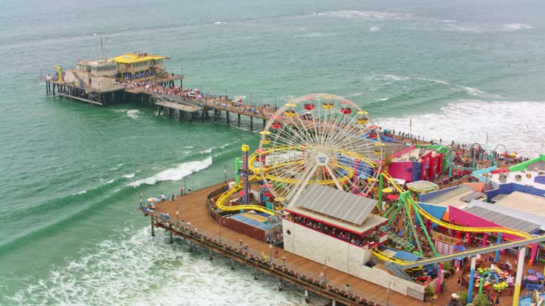 AERIAL Above the amusement park on Santa Monica Pier, California