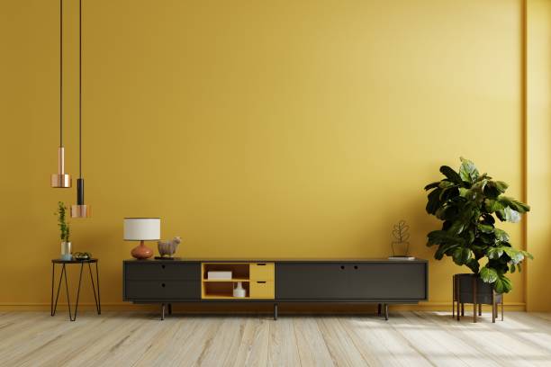 istock Black cabinet for tv interior yellow wall mockup. 1455629254