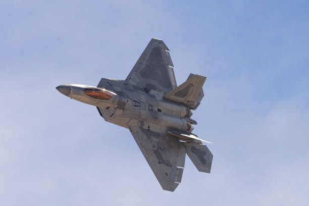 istock F-22 Raptor in a turn in beautiful light ,  with afterburners on 1455631884