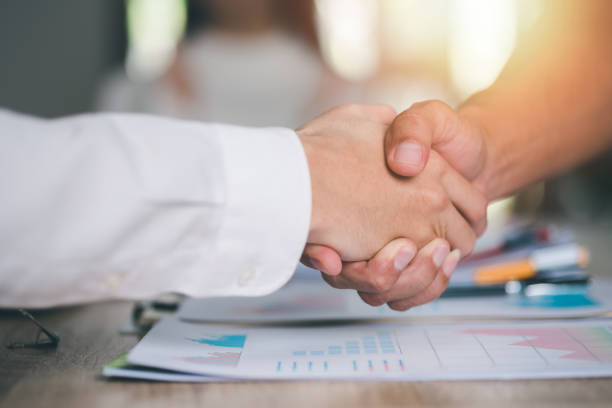 istock business people shaking hands indicating agreement business,concept progress in development, financial efficiency and investment with business strategy for goals and opportunities in industry future 1455631888