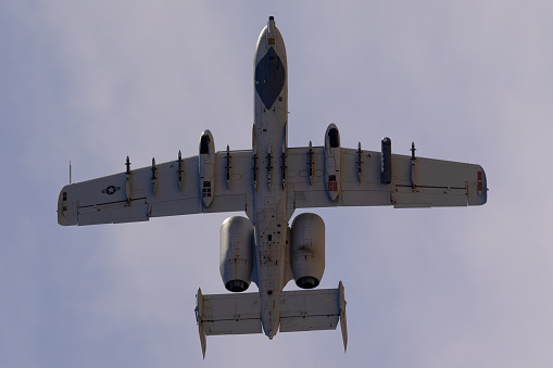 Bottom view of an A-10 Thunderbolt II in beautiful light