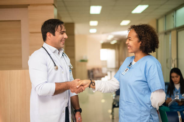 istock Doctor shake hand student success in education 1455633740