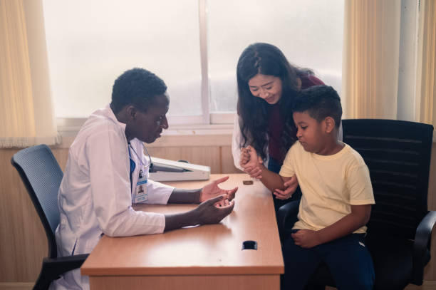 istock african american doctor examining black kid  with stethoscope 1455633744