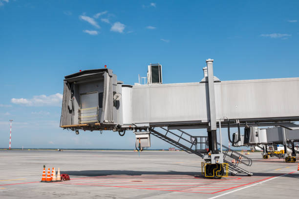 istock Empty passenger jet bridges at airport apron 1455635233
