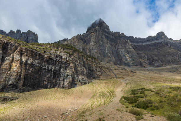 istock cliff walls in the clouds with dramatic lighting 1455636570