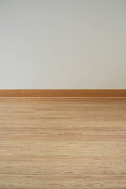 istock wooden floor and white wall, construction industry 1455638710
