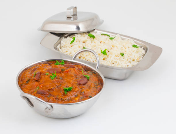 Rajma Chawal or Rajma Jeera Chawal (Rice) is a Traditional North Indian Food Rajma Chawal or Rajma Jeera Chawal (Rice) is a Traditional North Indian Food, Consisting of Cooked Red Kidney Beans in a Thick Gravy with Spices. Served with Jeera Rice fresh cilantro stock pictures, royalty-free photos & images