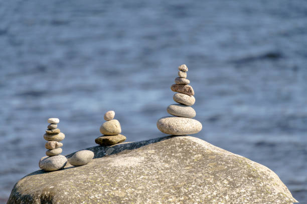 istock Pyramid of stones. Unstable balance of stone objects. 1455644469