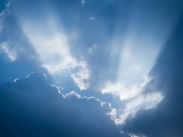 Photo of The rays of sunlight penetrate the clouds after rain.