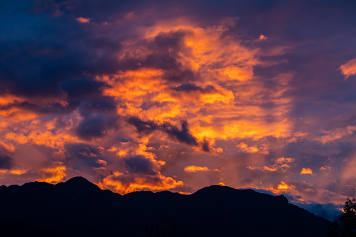 Hazy Landscape Flat Tops Mountains Summer Colorado View - Scenic views with wildfire smoke in air creating hazy skies and warm colors at sunset.