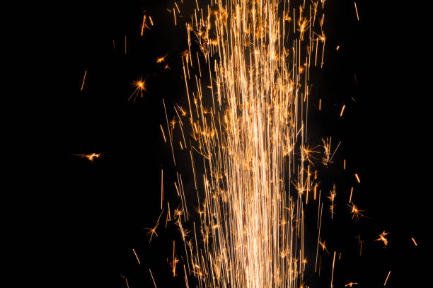 istock close up burning flare or flame with bright sparks and smoke on background with copy space. festive event concept. fireworks exploding at night. 1455647626