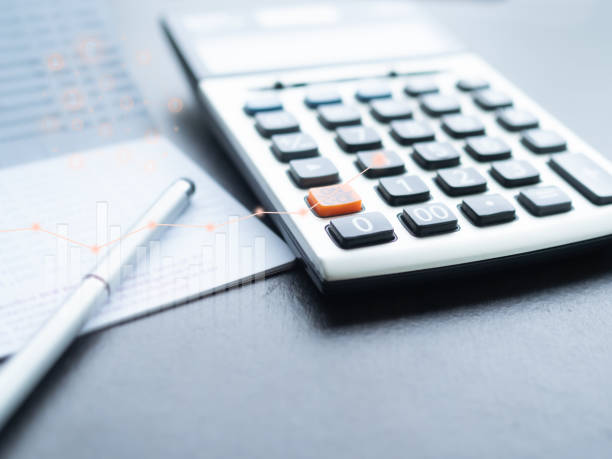 istock Calculator with Data Stock Market Candlestick Trade Forex Symbols 1455649946