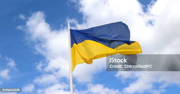 Yellow And Blue Flag Of Ukraine And Sky With Clouds In Background Stock Photo - Download Image Now