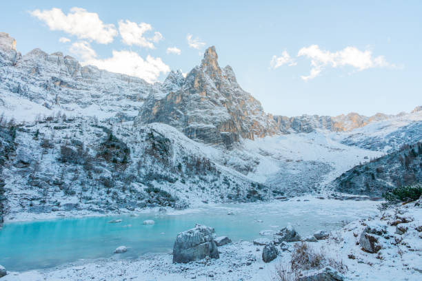 Scenic view of snow-covered lake in Dolomites in winter at sunset shot on film