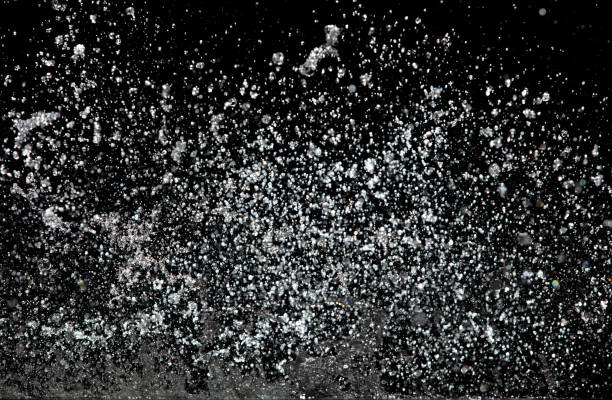 istock Blur Defocus Image of Water hit wall ground, explode into drop droplet. Amount Water attack impact and fluttering in air explosion. Stop motion freeze shot. Splash Water for texture elements 1455656058