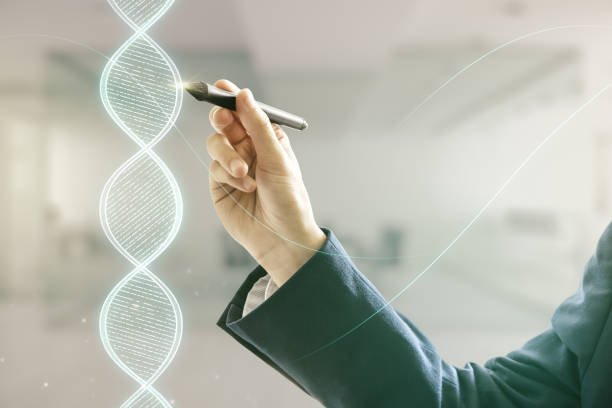 istock Man hand with pen working with DNA hologram on blurred interior background, science and biology concept. Multiexposure 1455657842