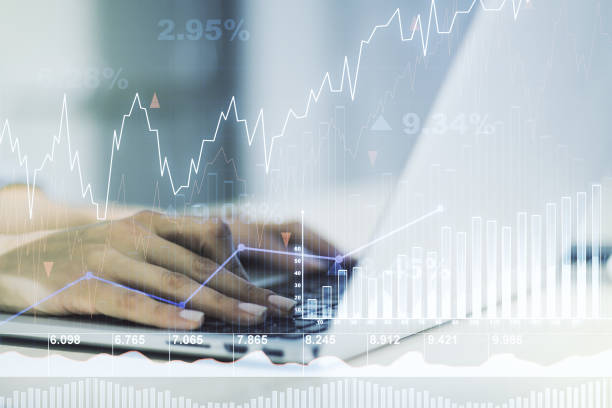istock Double exposure of abstract creative financial chart with hand typing on computer keyboard on background, research and strategy concept 1455657892
