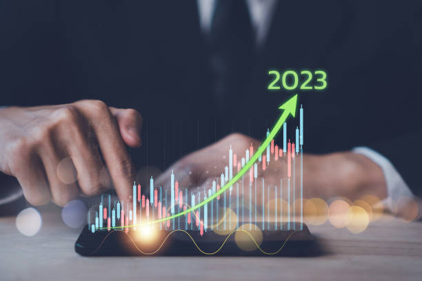 istock Business growing in 2023. Businessman hand touch smartphone with virtual increasing technical graph and up arrow for trader analysis. Stock, Cryptocurrency chart trader, trading, investment. 1455658558