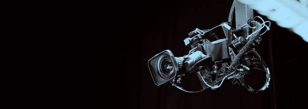istock TV Camera broadcast on the crane tripod for shooting or recording and broadcasting content in studio production to on air tv or online internet live show. HD Video recording on crane. Selective focus. 1455660949