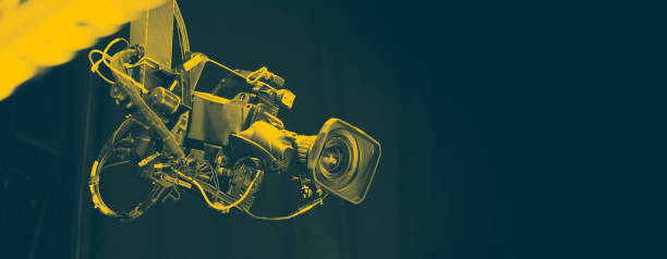 istock TV Camera broadcast on the crane tripod for shooting or recording and broadcasting content in studio production to on air tv or online internet live show. HD Video recording on crane. Selective focus. 1455660950
