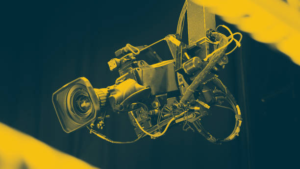 istock TV Camera broadcast on the crane tripod for shooting or recording and broadcasting content in studio production to on air tv or online internet live show. HD Video recording on crane. Selective focus. 1455660970
