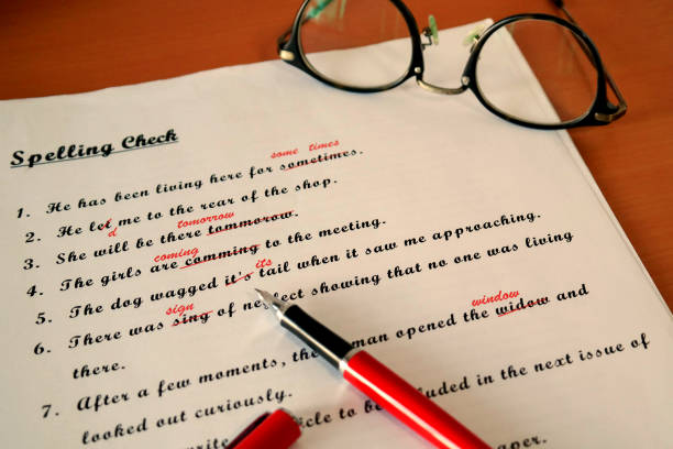 spelling check paperwork with red mark spelling check paperwork with red mark error correction misspelled stock pictures, royalty-free photos & images