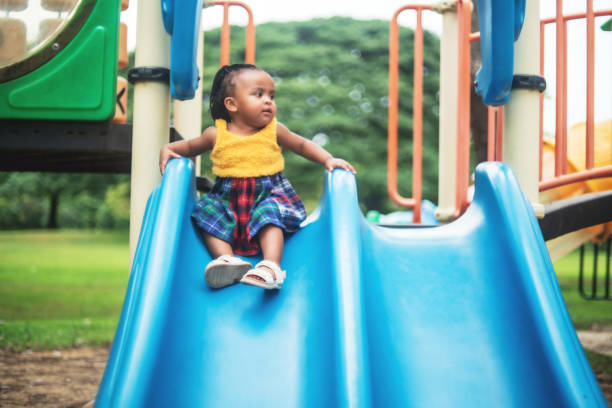 Playing on the Slide in the Park