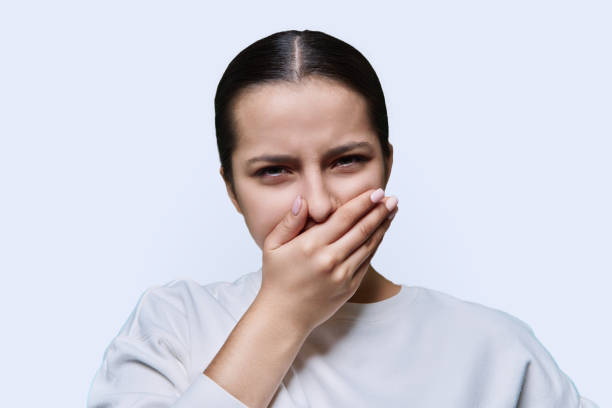 istock Teenage girl having toothache, on white studio background 1455664540