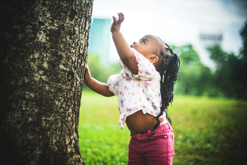 African little girl feeling curious about nature