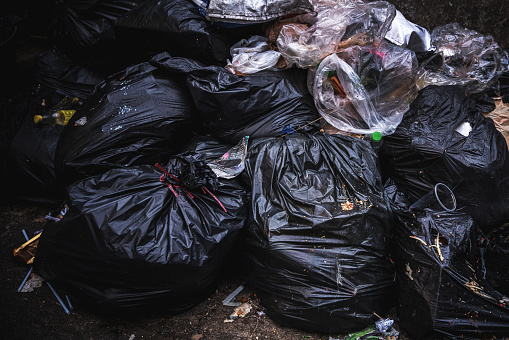Pile of black plastic garbage bags in bangkok