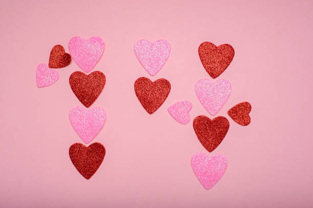 istock Multiple hearts with glitter forming a number 14 on pink background. Love concept. 1455666832