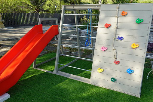 Playground set with climbing station and slides