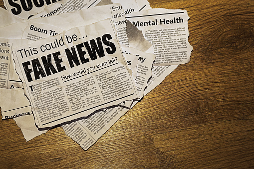 Pile of simulated newspaper clippings is topped by one sowing doubt about whether the reader can tell the difference between fake news and real news. Text was written from scratch by the photographer (an experienced journalist), who also did the design, so this image is free of third-party copyright and may be used without restrictions. Although the text was written with plausibility in mind, no claim of truth or accuracy is made about it.