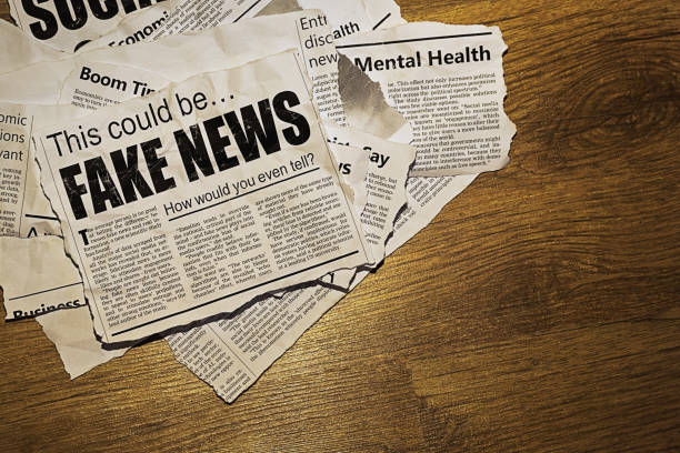 Tabloid newspaper headline screams about fake news being believed Pile of simulated newspaper clippings is topped by one sowing doubt about whether the reader can tell the difference between fake news and real news. Text was written from scratch by the photographer (an experienced journalist), who also did the design, so this image is free of third-party copyright and may be used without restrictions. Although the text was written with plausibility in mind, no claim of truth or accuracy is made about it. medium group of objects stock pictures, royalty-free photos & images