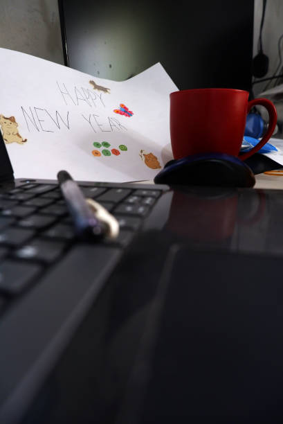 istock Happy new year drawing on a messy desk 1455669358