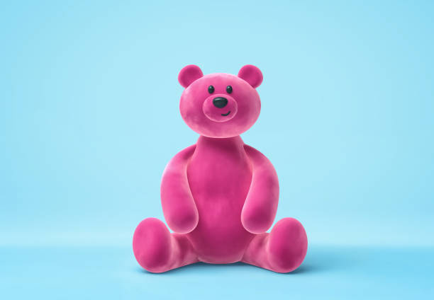 istock Pink smiling bear toy isolated on blue background. Clipping path included 1455672249
