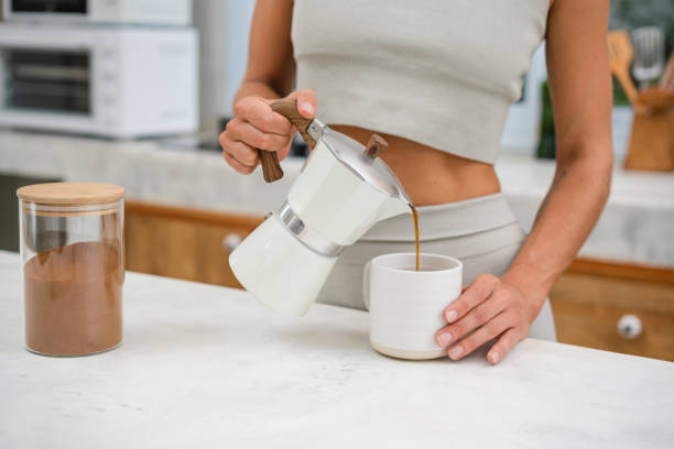 istock An unrecognizable woman pouring coffee into a cup 1455672255