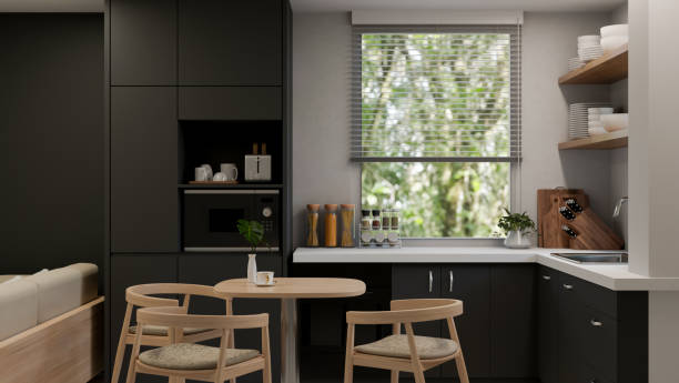 istock Modern stylish black and white kitchen with black kitchen cabinet and cupboard, dining table 1455672956
