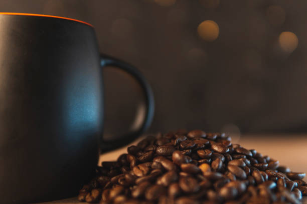 istock Closeup of a cup near coffee beans 1455673885