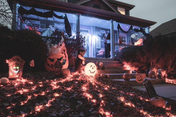 istock House exterior decorated with lights and pumpkins ready for Halloween 1455676079