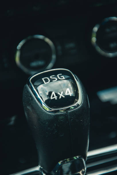 istock Vertical macro shot of a black gear stick with white text and reflection 1455676334