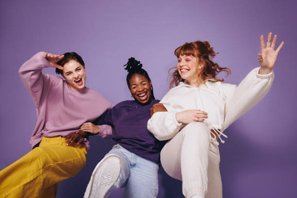 istock Energetic female friends dancing and celebrating in a studio 1455676522